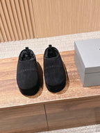 Black Balenciaga slip-on sandals with round toe and dark interior lining