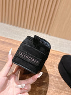 Black Balenciaga slip-on sandal heel detail with logo patch and padding