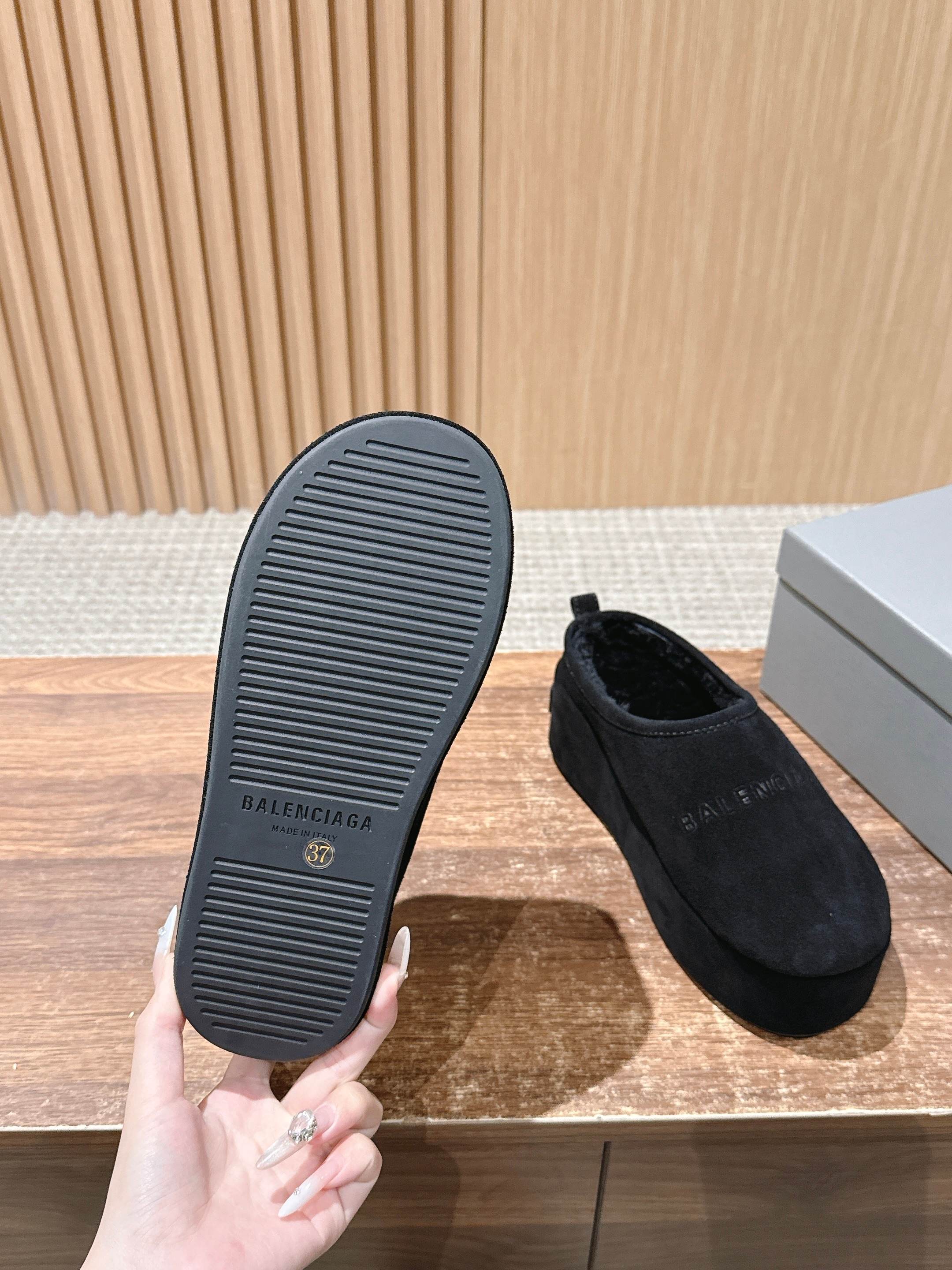 Black suede mule outsole with ridged tread and Balenciaga logo on sole