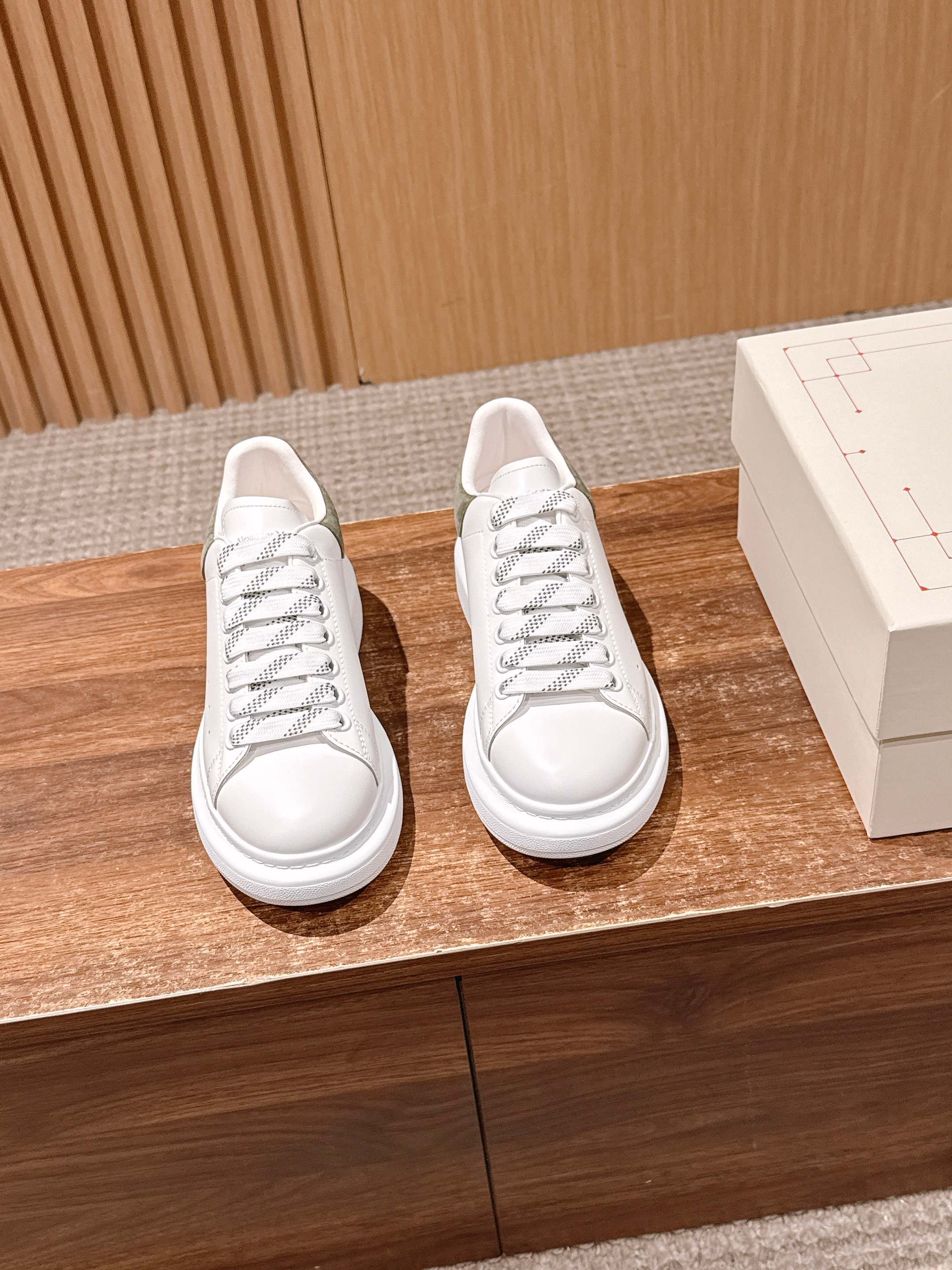 Alexander McQueen white leather lace-up sneakers with olive heel accents