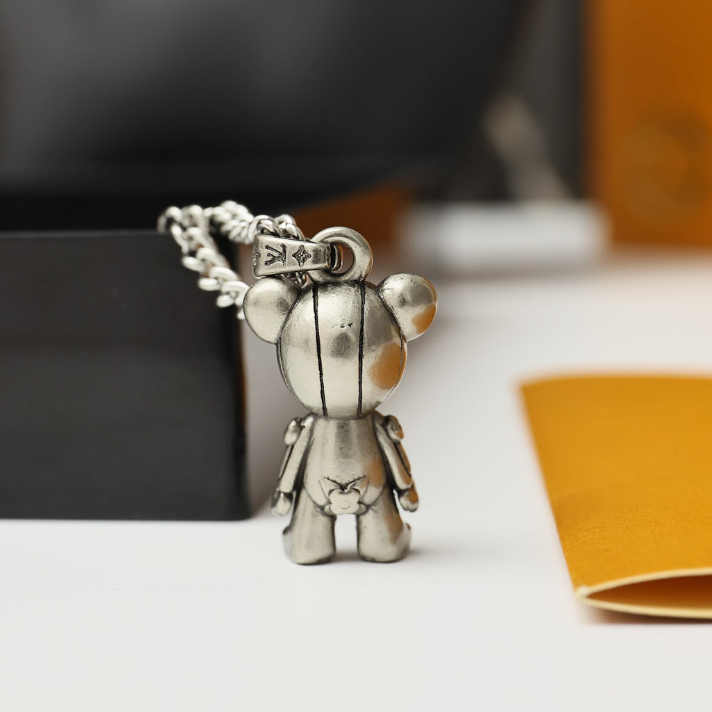 Silver bear figurine charm necklace pendant with small crown detail