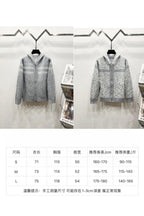 Clothing size chart table with sizes and sleeve/length measurements