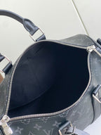 Louis Vuitton bag interior view through open zipper in dark navy monogram canvas