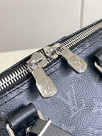 Louis Vuitton bag zipper pulls with silver hardware on dark navy leather
