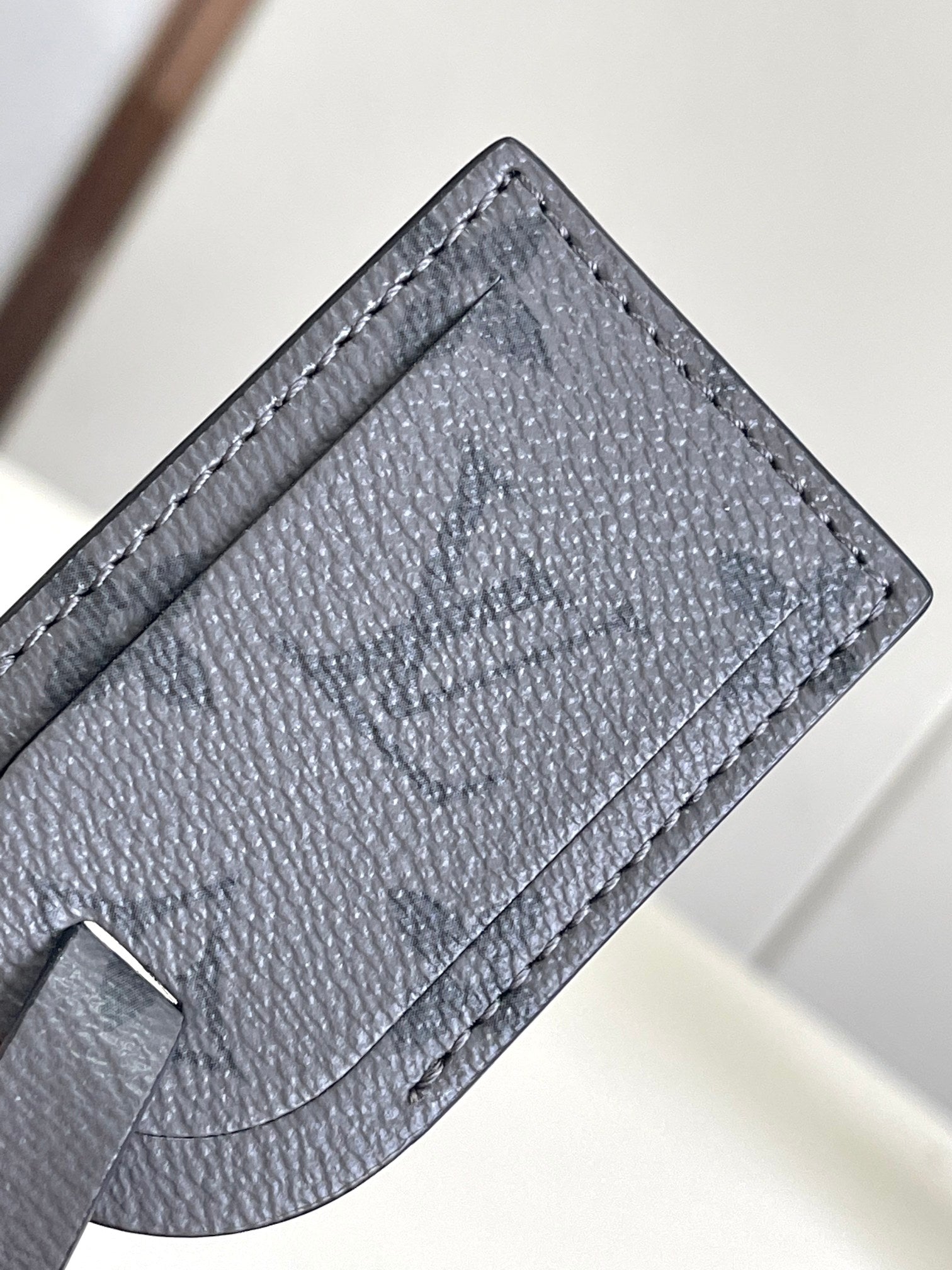 Louis Vuitton bag leather pocket lining panel in dark navy with curved edge stitching
