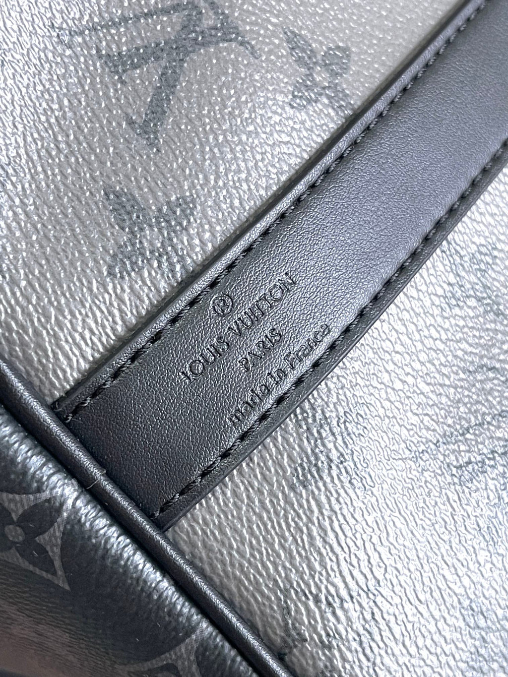 Louis Vuitton bag leather label and stitching on dark navy trim