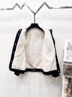 Louis Vuitton denim jacket open with white shearling lining and snap-button front