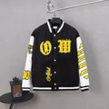Black and white varsity jacket with snap buttons and yellow logo patches