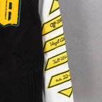 White sleeve panel with yellow geometric logo trim and black stripe accents