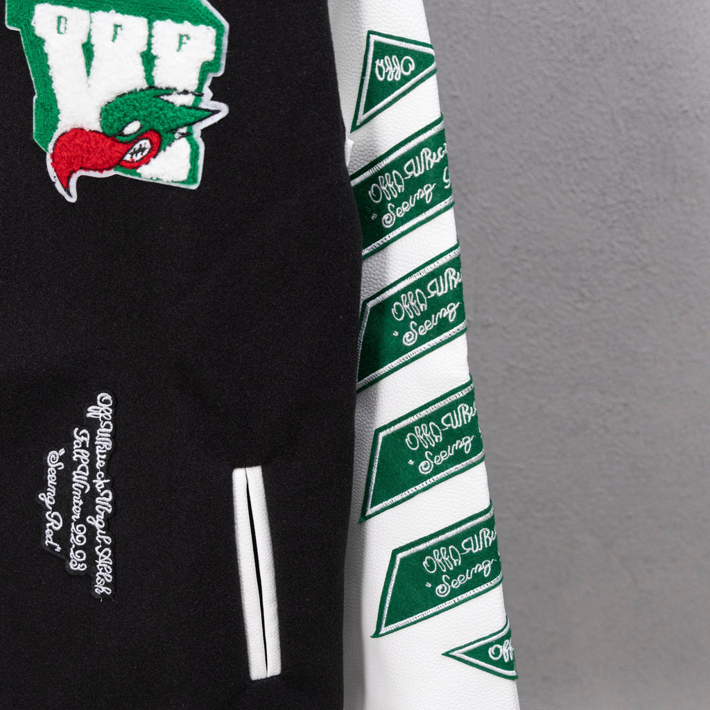 Black and white sleeve with repeating green logo bands