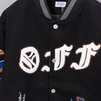 Black varsity jacket front with embroidered monogram patch and snap buttons.