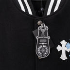 Black jacket with striped ribbed collar, metal button closure, hanging tag, cross applique