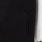 Black jacket with side welt pocket and smooth fabric