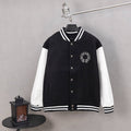Black varsity jacket with white sleeves, striped ribbed collar and cuffs, snap buttons