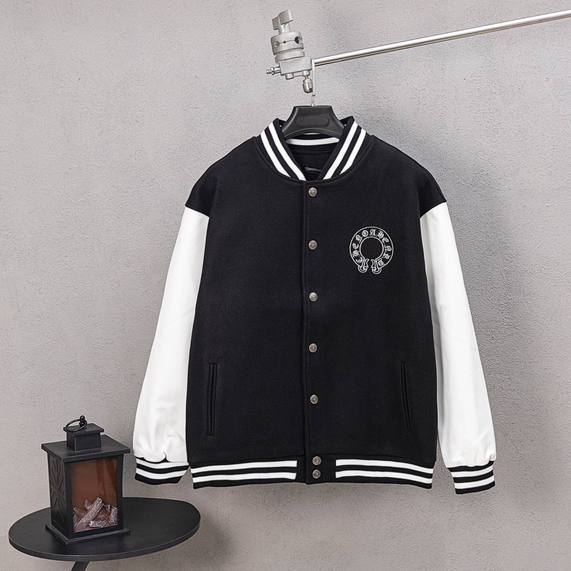 Black varsity jacket with white sleeves, striped ribbed collar and cuffs, snap buttons