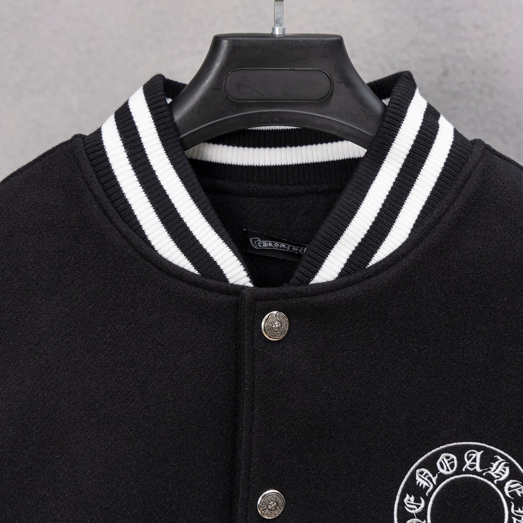 Black varsity jacket with striped knit collar and silver snap front buttons