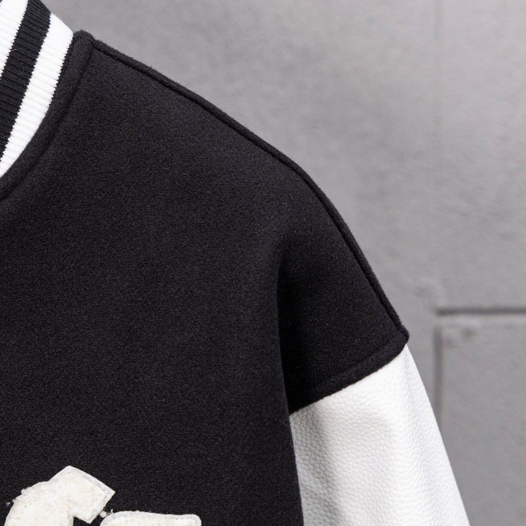 Black short sleeve with white sleeve panel and striped rib trim