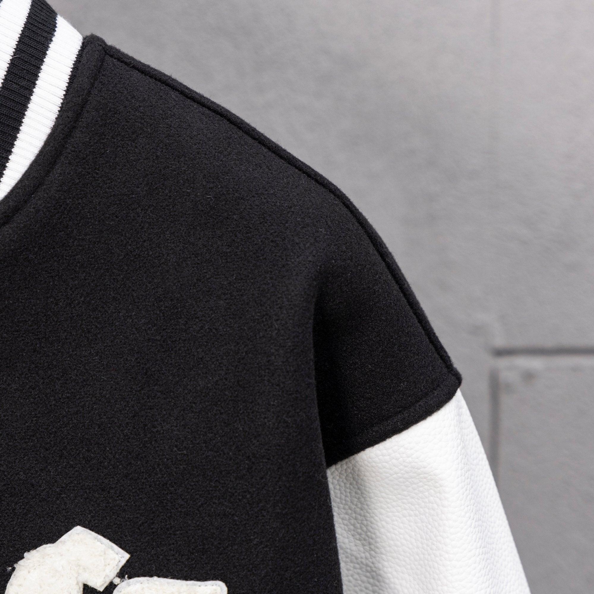 Black short sleeve with white sleeve panel and striped rib trim