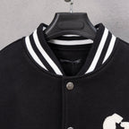 Black varsity jacket with striped ribbed collar and snap button placket