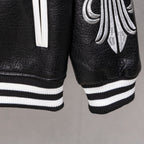 Black leather jacket hem with ribbed white-and-black striped cuffs and sleeve graphic