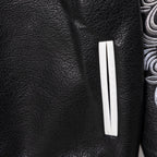 Black leather jacket with rectangular white stripe patch on the sleeve