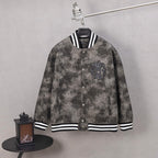 Long-sleeve button varsity jacket with black fleur-de-lis crest, striped cuffs and hem