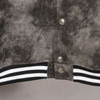 Varsity jacket front button placket with black-and-white striped hem band