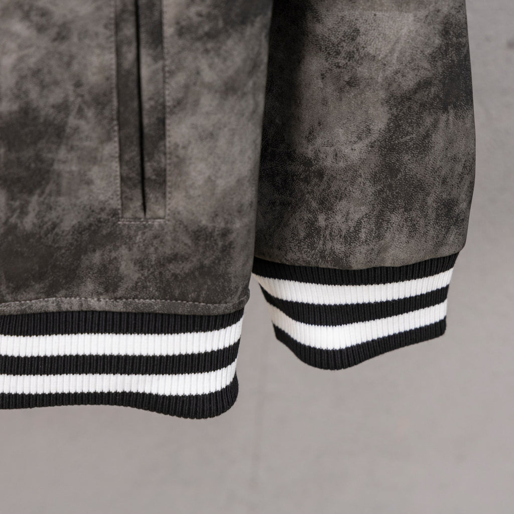 Long-sleeve varsity jacket sleeve cuff with ribbed black-and-white stripes