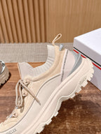 Moncler beige lace-up sneaker side view with padded collar and sole detail.