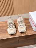 Moncler beige lace-up sneakers with chunky sole, shown as a pair.