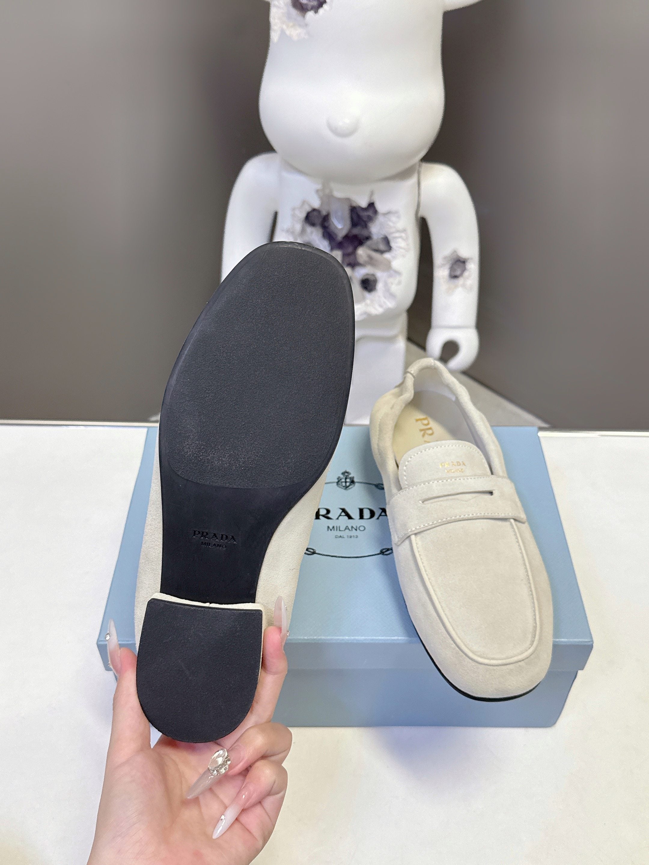 Prada suede loafer underside and heel view with black rubber soles