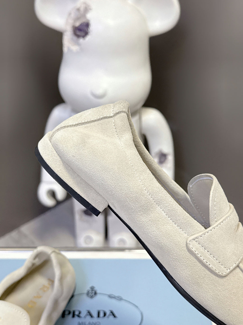 Prada suede loafer, light beige with visible heel and black rubber trim