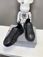 Prada unisex sneakers, black low-top lace-up with cushioned sole