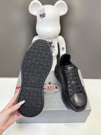 Prada unisex sneakers, black outsole view with geometric tread pattern