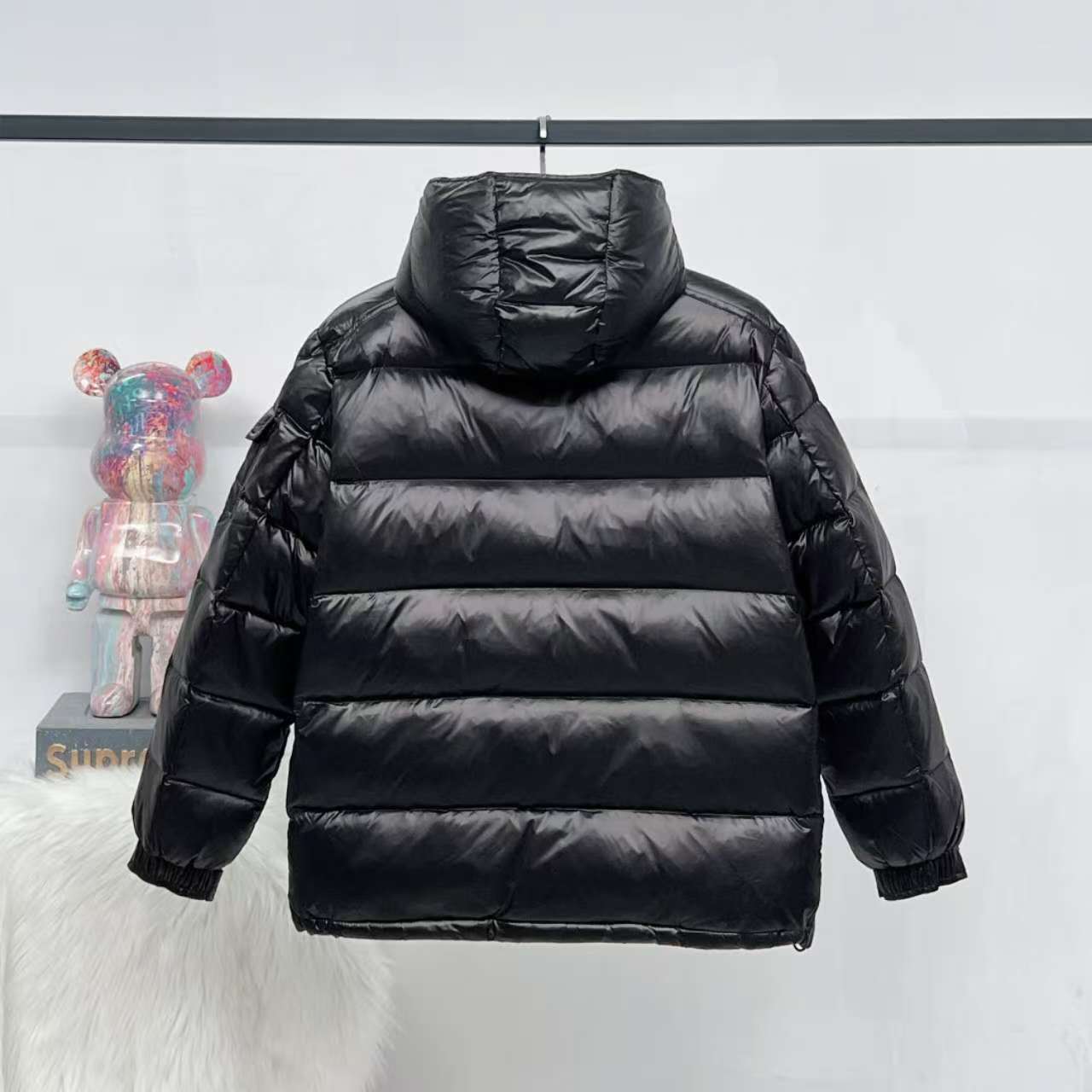 Moncler long puffer jacket, dark color, stand collar, full-zip design with quilted stripes