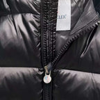 Moncler puffer jacket close-up, dark color, full-zip front with metal zipper pull