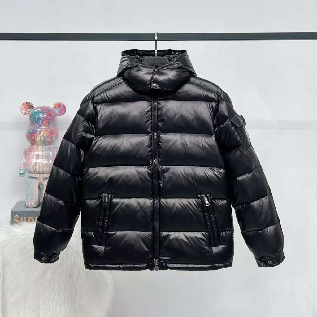 Moncler long puffer jacket in dark color, full-zip with stand collar and quilted panels