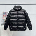 Moncler long puffer jacket in dark color, full-zip with stand collar and quilted panels