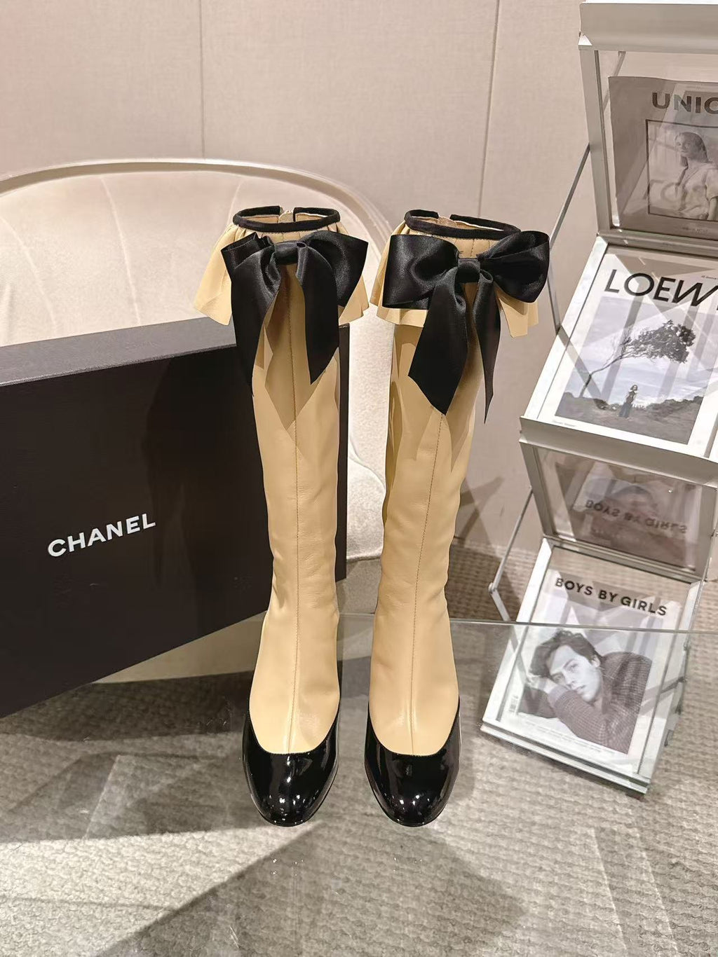 Chanel ladies’ knee-high boots with black glossy toe and bow trim