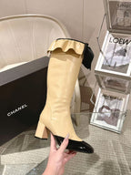Chanel ladies’ knee-high boots with block heel, cream shaft, black patent toe