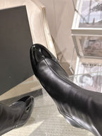 Black leather pointed-toe heel, shown from the side