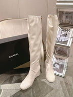Chanel light white knee-high boots with pointed toe and glossy finish