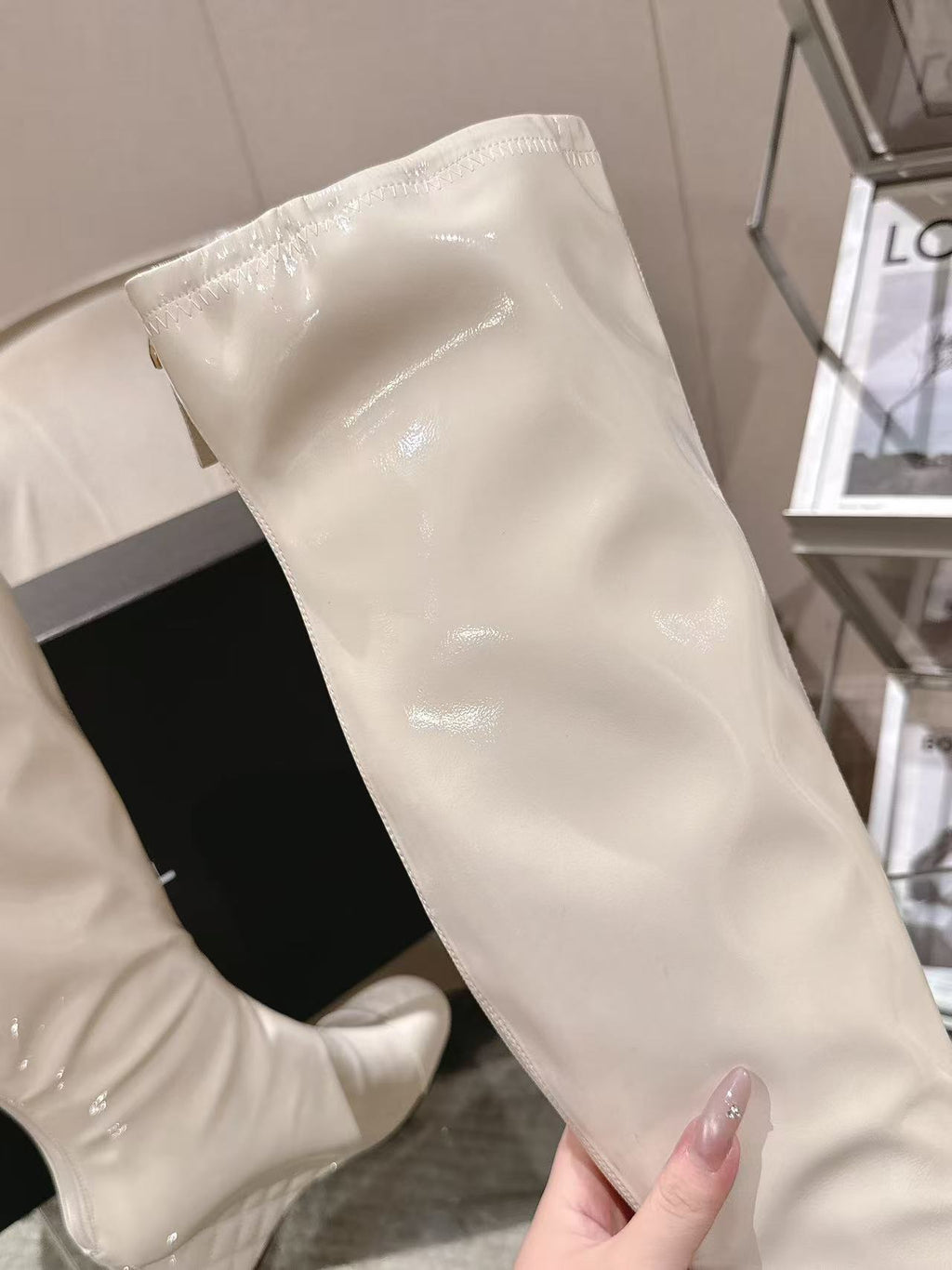 Chanel knee-high boot upper in light white patent leather, close-up