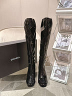 Chanel black patent leather knee-high boots, glossy finish, stacked heels