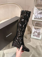 Chanel black patent leather knee-high boot, close-up of front shaft and toe