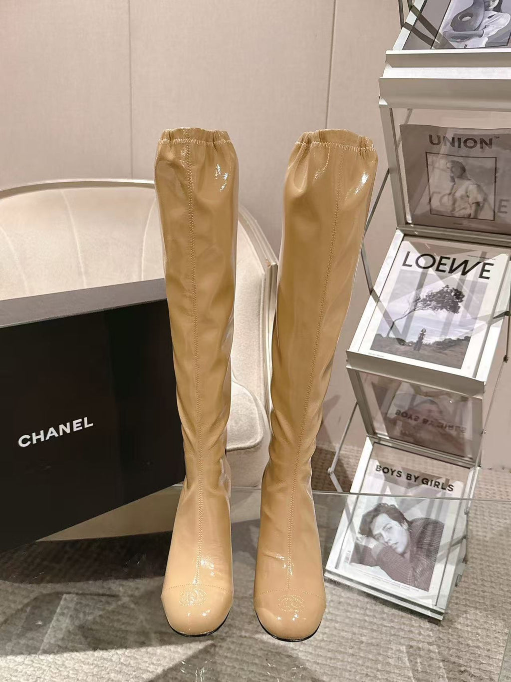 Chanel glossy beige knee-high boots with slim heel, full pair view