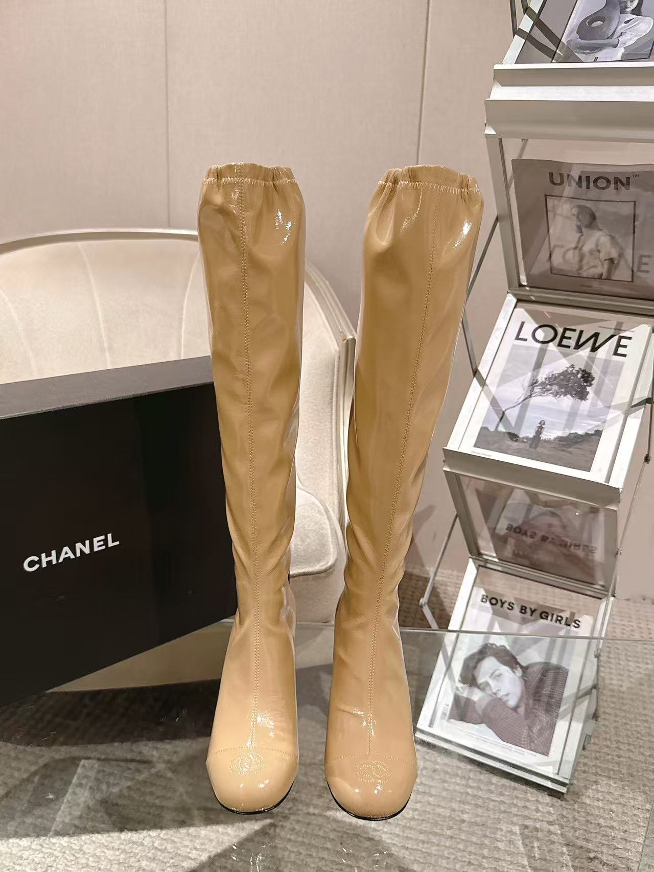 Chanel glossy beige knee-high boots with slim heel, full pair view