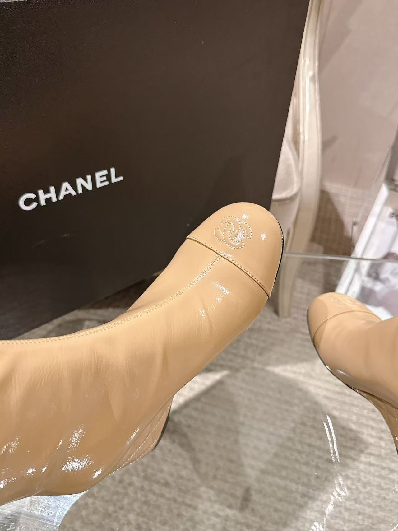 Chanel glossy beige knee-high boot, seam detail and rounded toe close-up