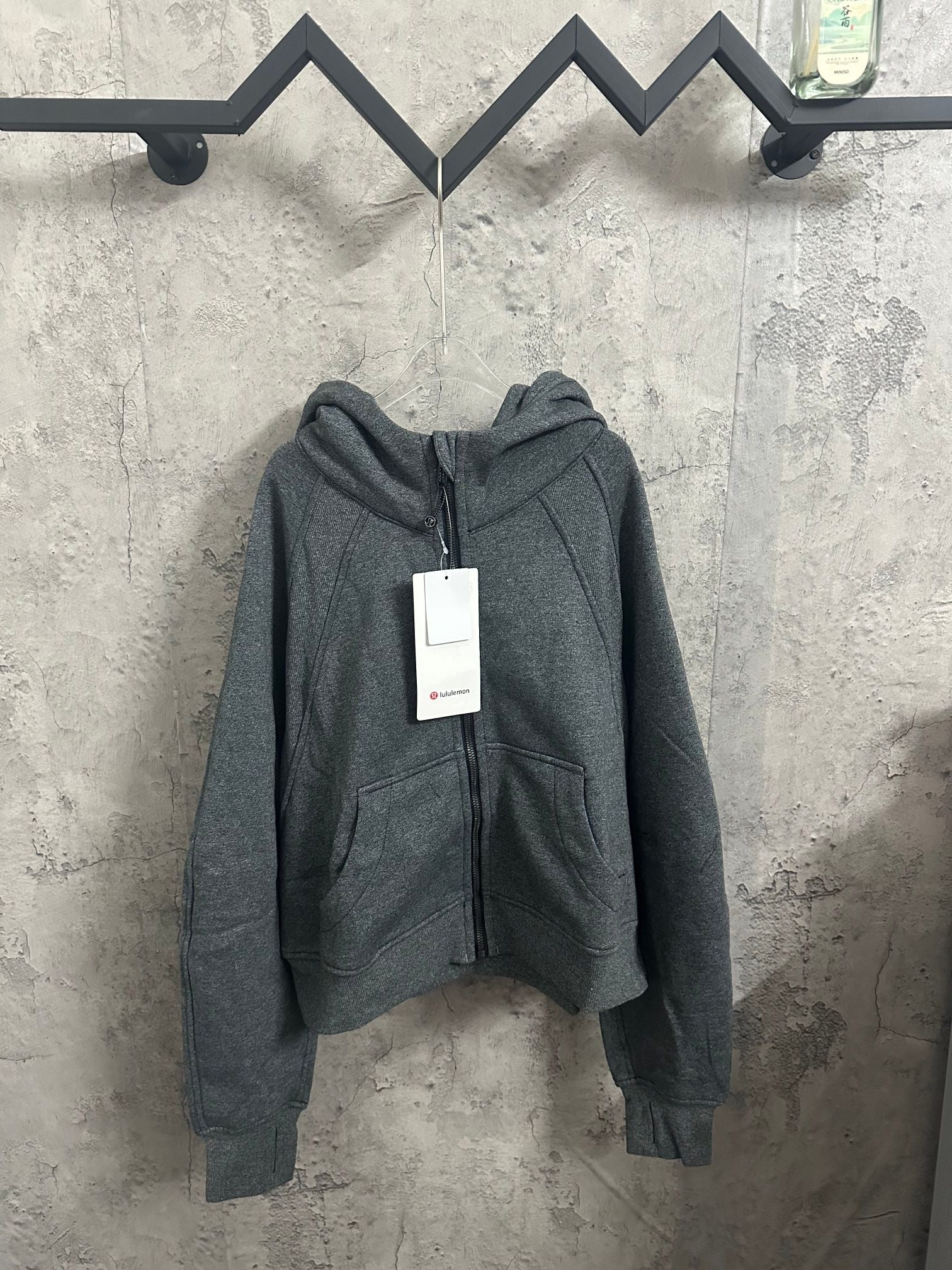 Dark gray zip-up hoodie with hood and front pockets