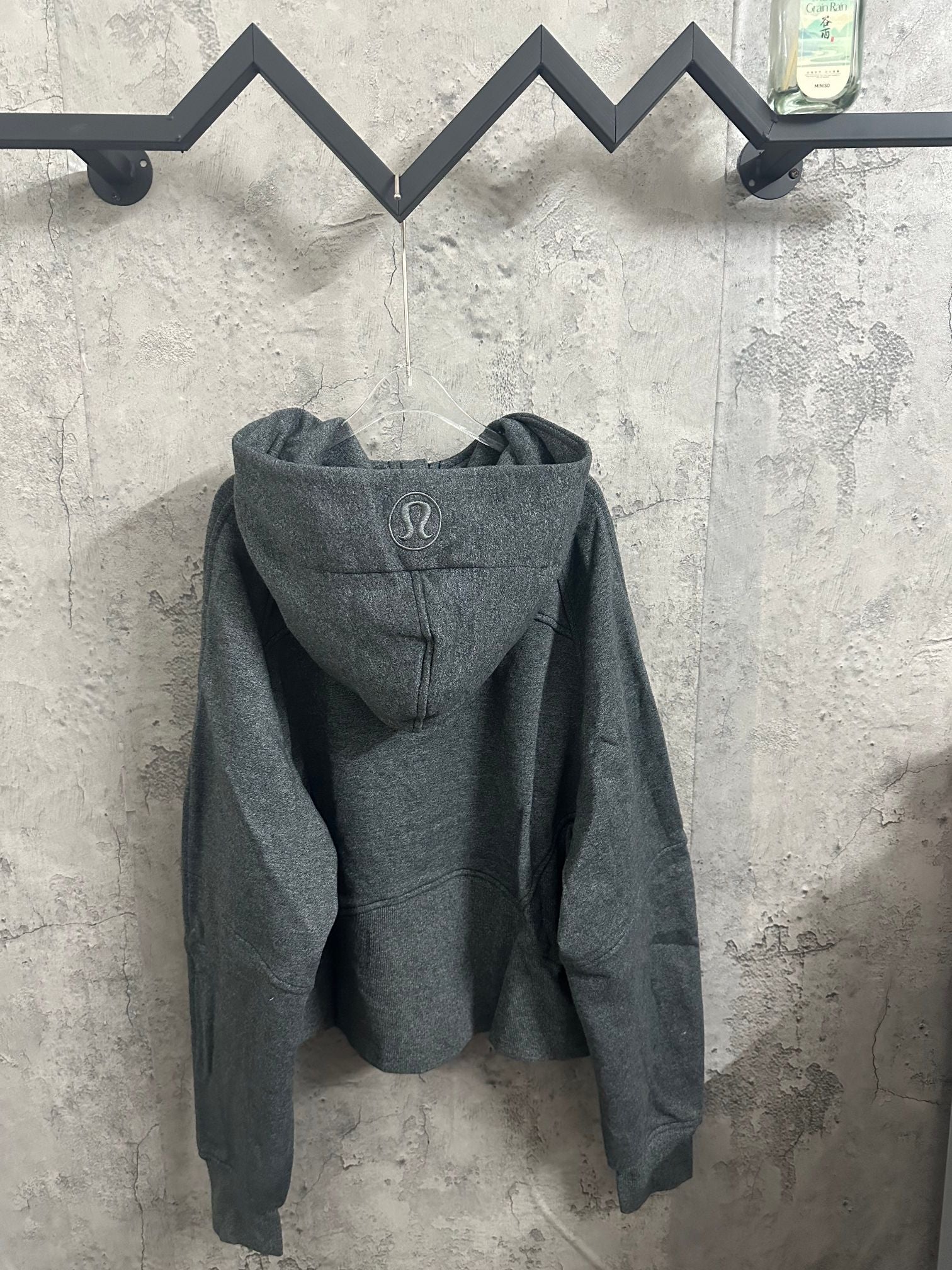 Dark gray pullover hoodie with hood and kangaroo pocket